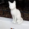 Modern sitting cat